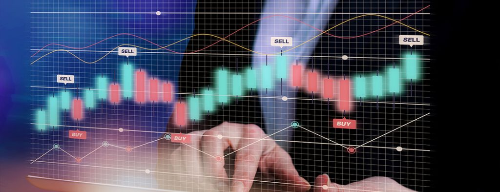 trading graph and a hand behind